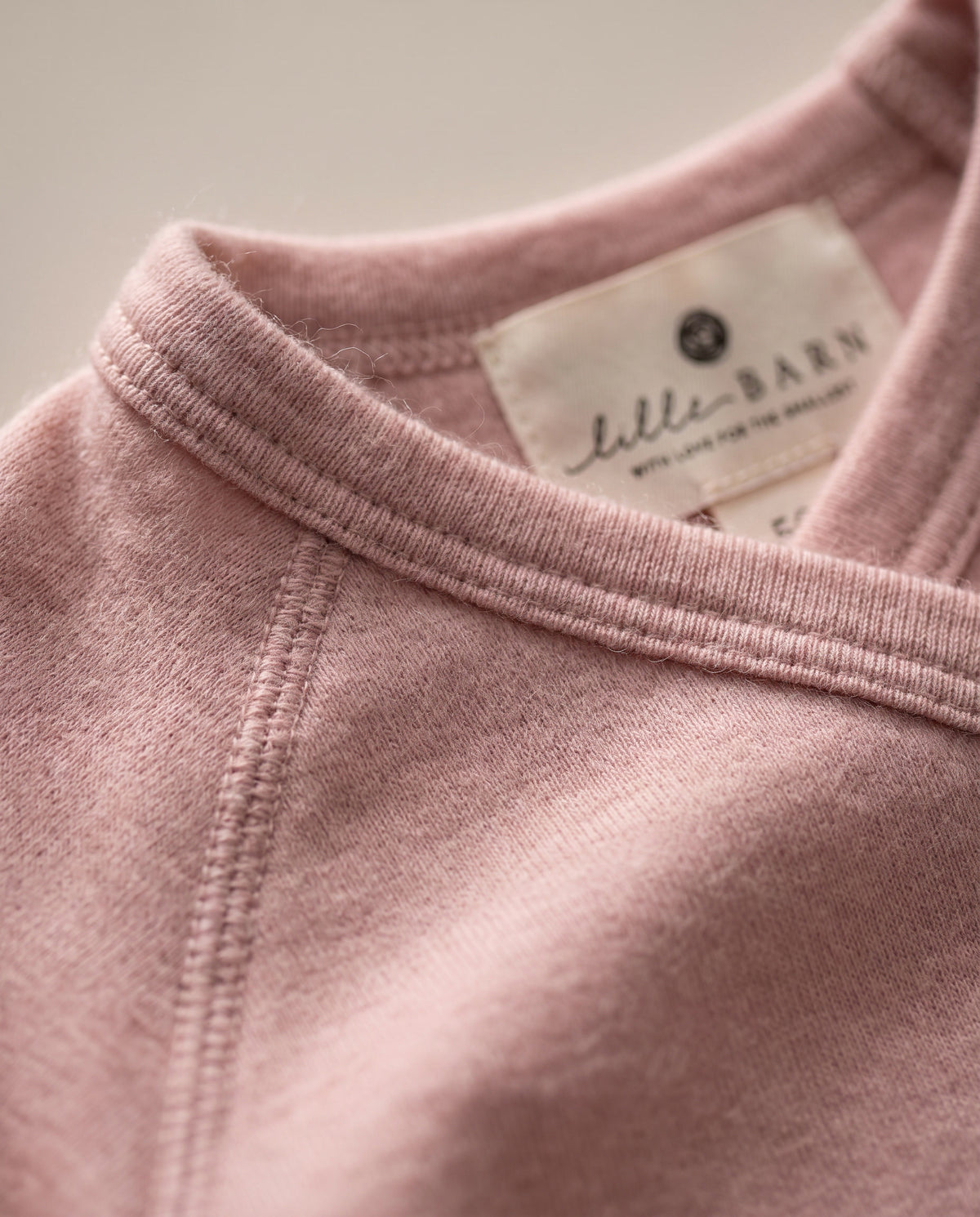 Wollstrampler mit Füßen – Merinowolle – Misty Rose